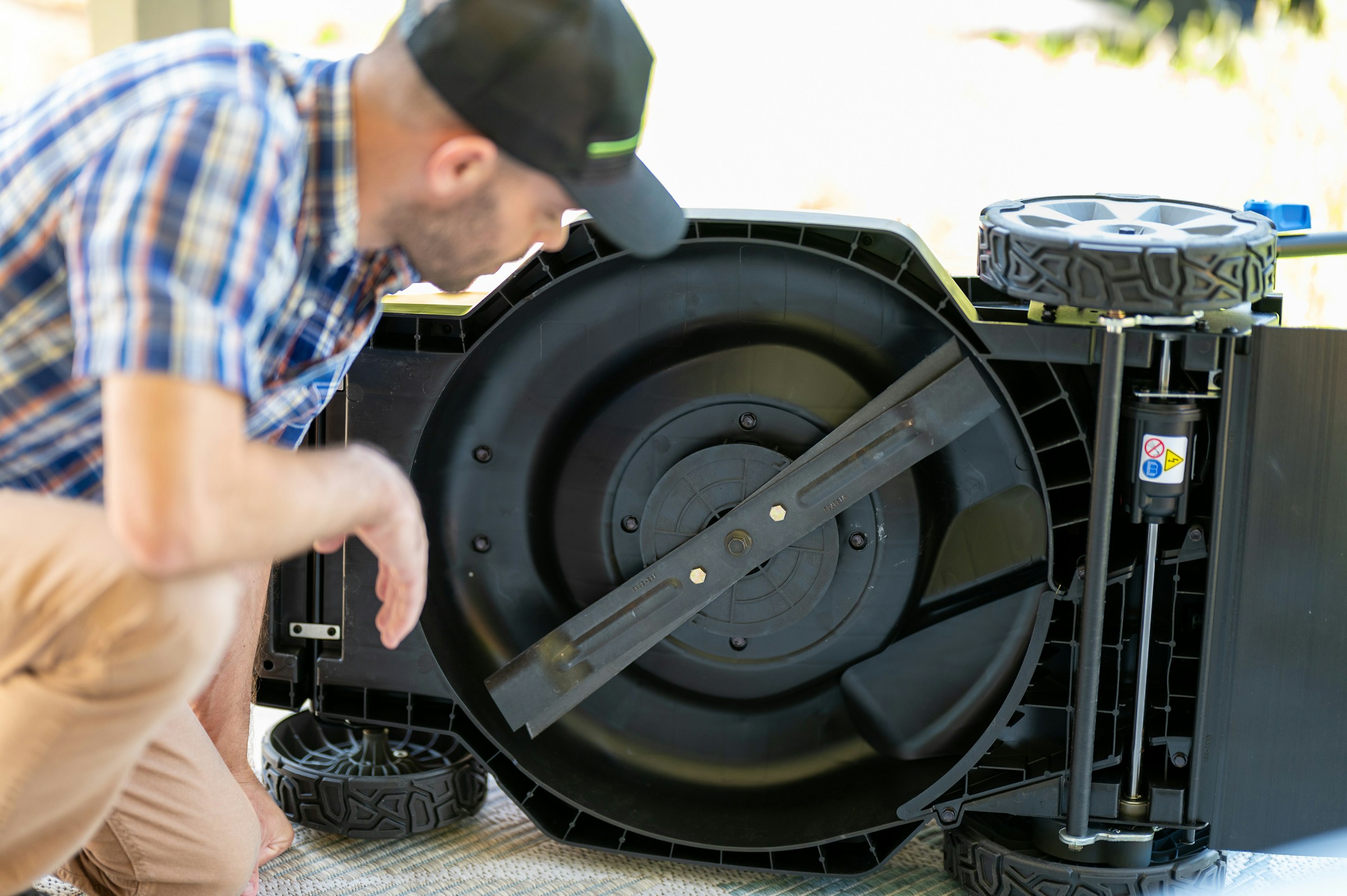 Technician working on a mower in the Adaptiv shop